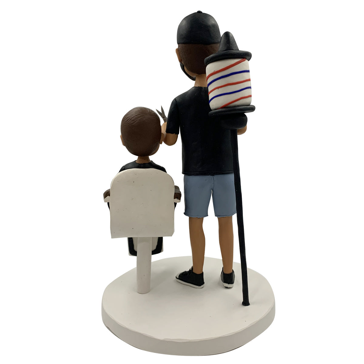 Barber Bobblehead avec un enfant