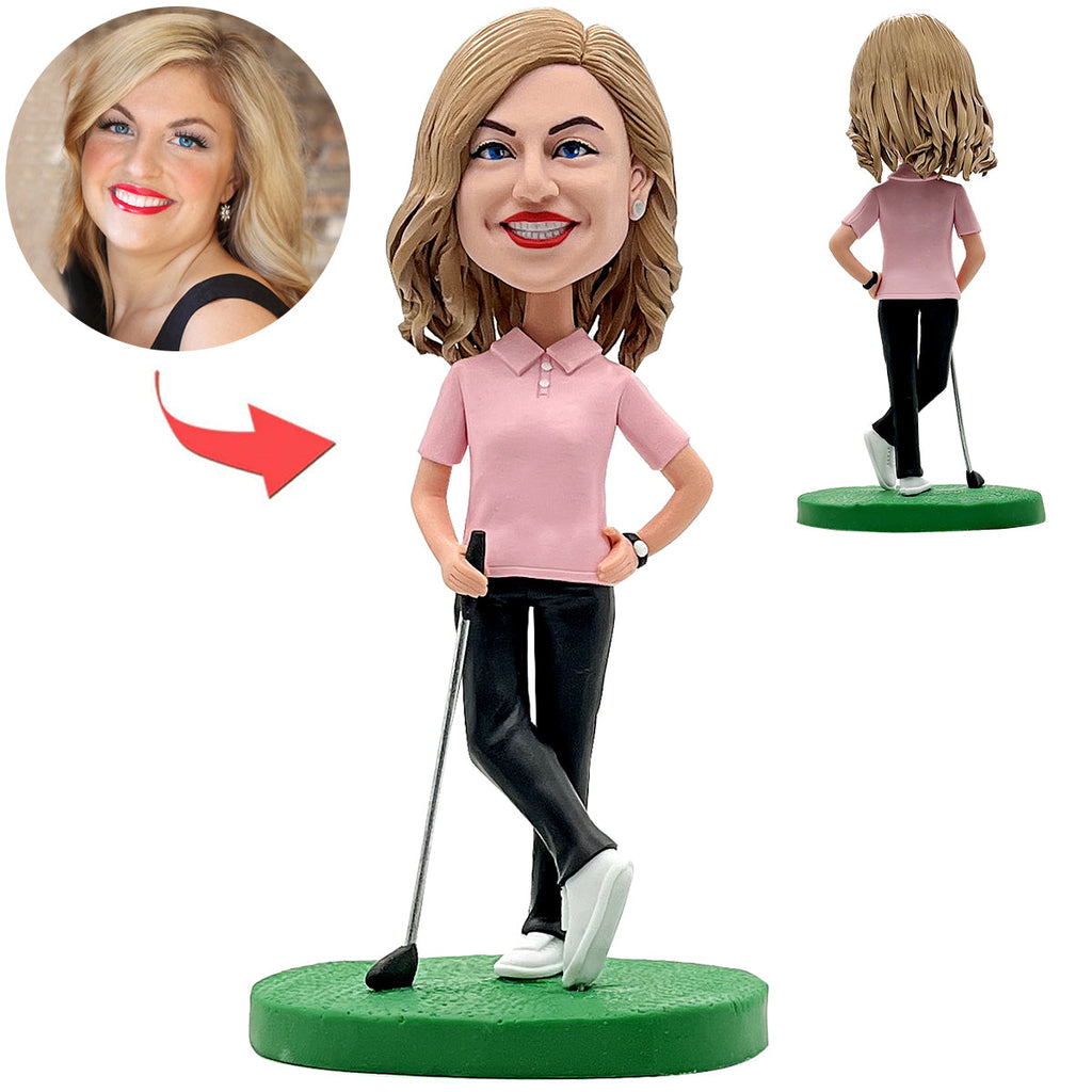 Bobblehead de golf féminine heureuse en chemise rose