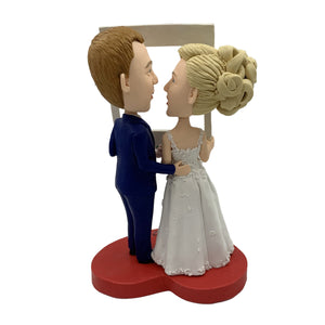 Bobblehead de gâteau de mariage avec cadre photo