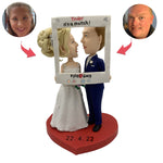 Bobblehead de gâteau de mariage avec cadre photo